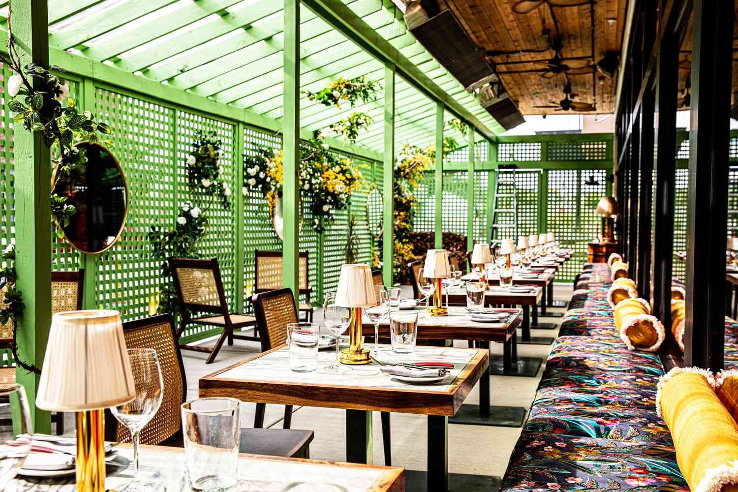 Restaurant dining room with tables, banquette seating and natural light